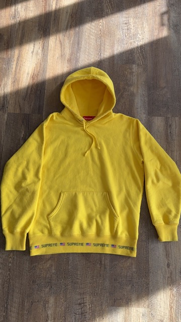 Original casual product photo of a yellow hoodie